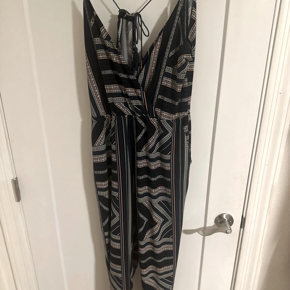 BCBG jumpsuit, in multi colors, and open back.